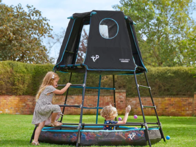 child's play climbing frame in garden with two children playing