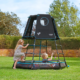 child's play climbing frame in garden with two children playing