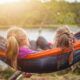 two girls lying on hammock