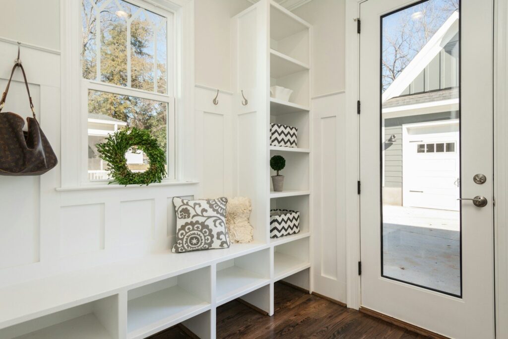 white shelving and seating in porch in home