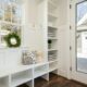 white shelving and seating in porch in home